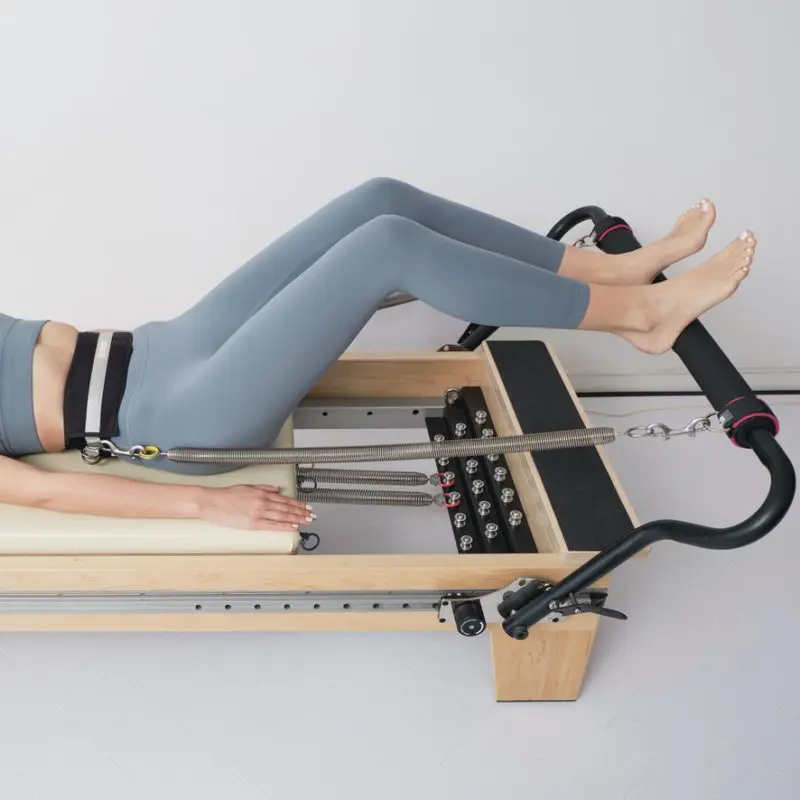 ELEMENTS Pilates Lumbar Belt Studio ELEMENTS Lumbar Belt in use on Pilates Reformer