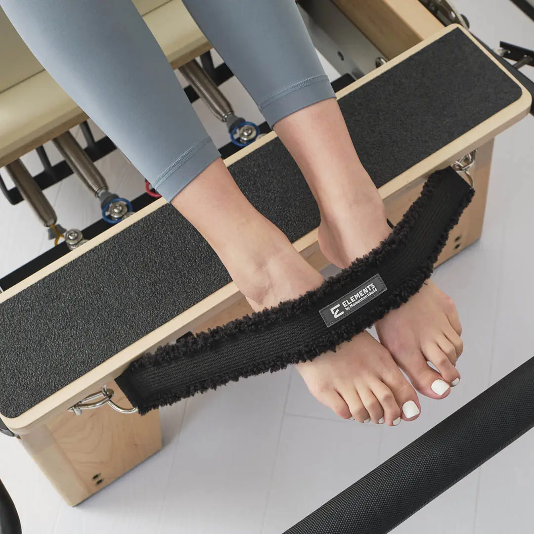 ELEMENTS Reformer Cadillac Foot Strap Pilates safety foot strap black faux fur in use